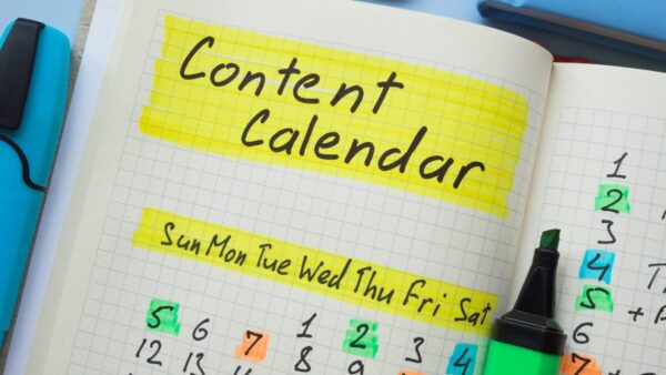 Open notebook with content calendar written