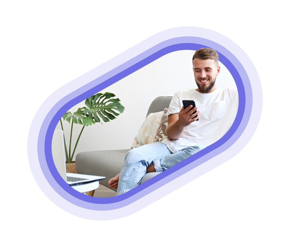 A person in a white shirt looking at their phone