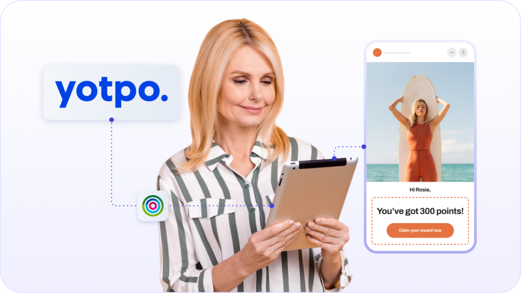 Happy woman looking at ipad & loyalty rewards